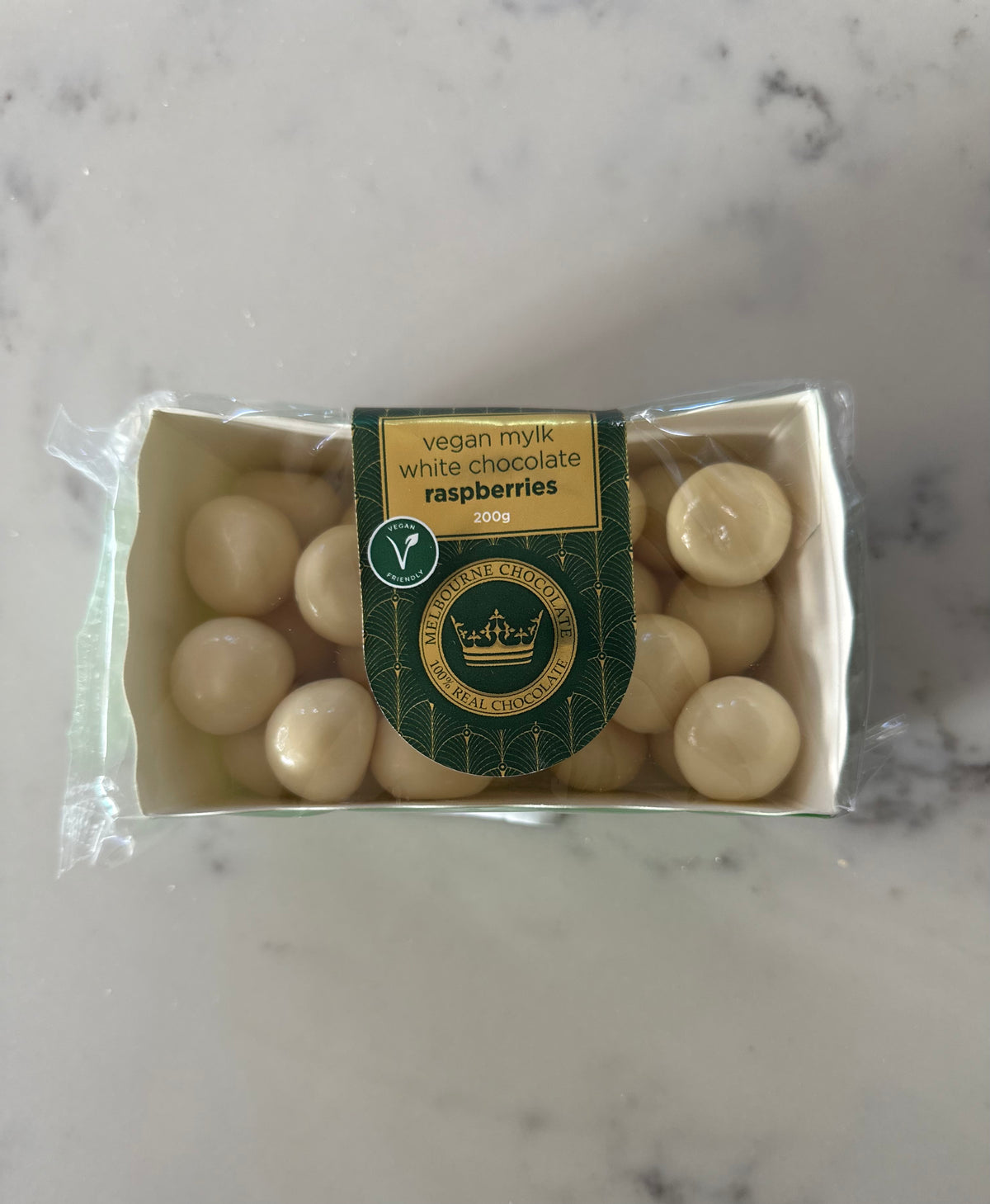 Vegan white chocolate coated raspberries